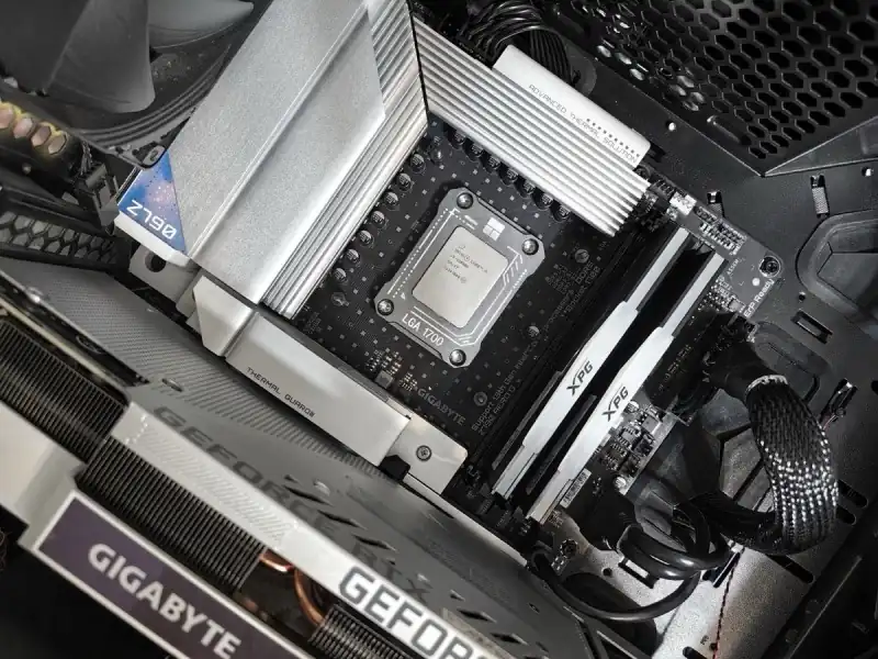 The inside of a computer showing the processor socket, memory and a graphics card
